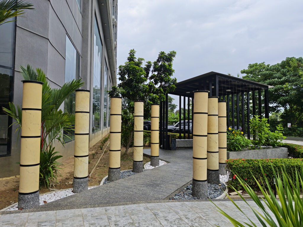 Outdoor pergola with pebble-wash finish at Livingston Hotel Sandakan